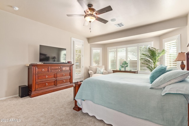 bedroom with light carpet and ceiling fan