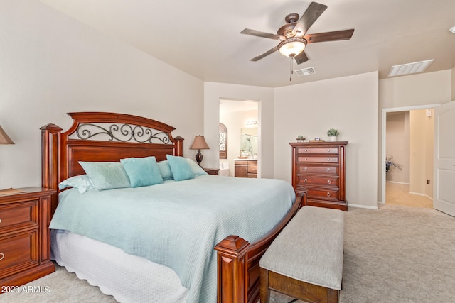 carpeted bedroom with ceiling fan and connected bathroom