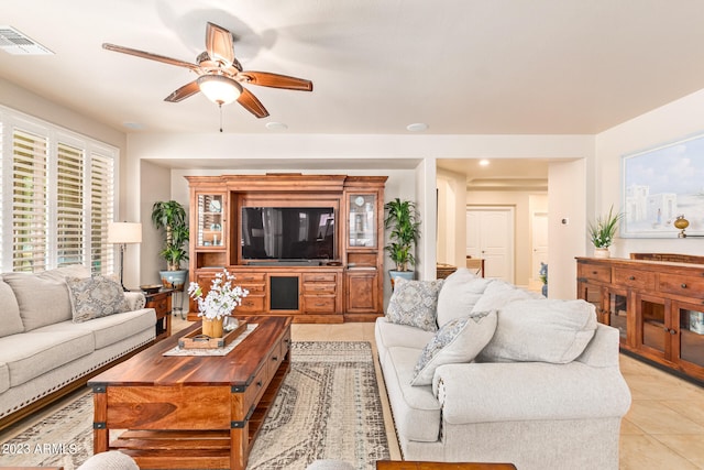 living room with light tile patterned flooring and ceiling fan