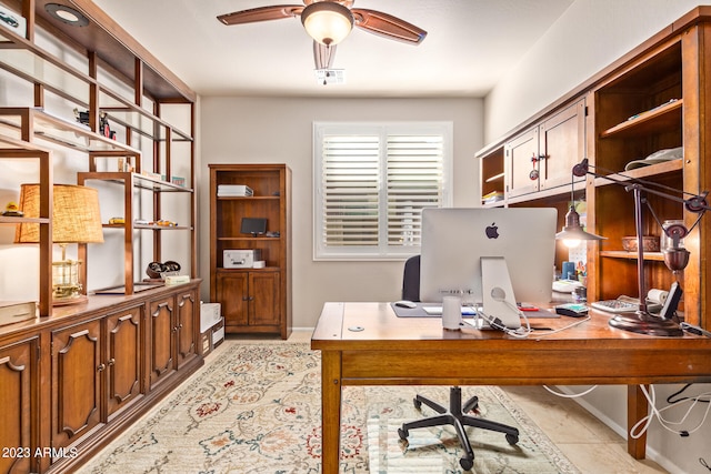 tiled office space with ceiling fan