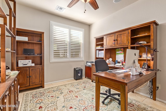 tiled home office with ceiling fan