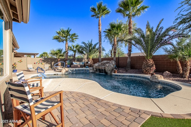 view of swimming pool featuring a patio and pool water feature