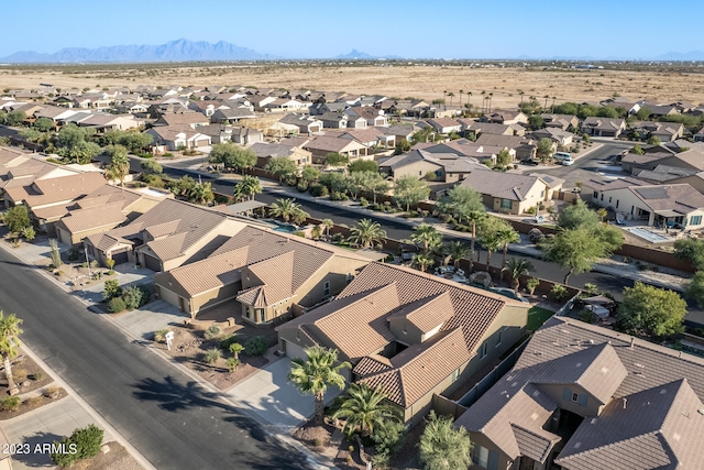 birds eye view of property with a mountain view