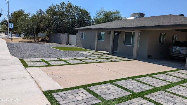 view of front facade with a carport