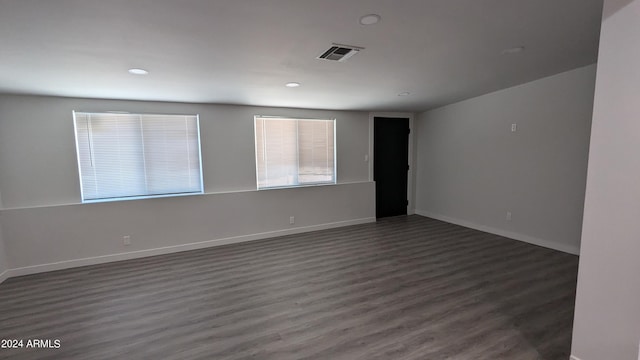 spare room featuring dark hardwood / wood-style floors