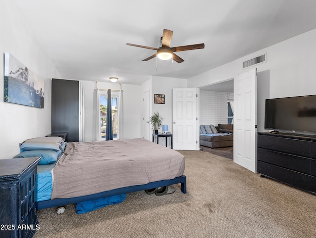 bedroom with ceiling fan and carpet flooring