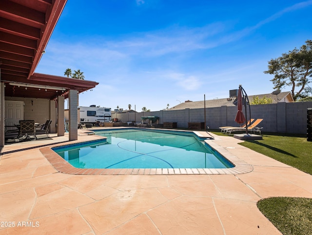 view of swimming pool with a patio area