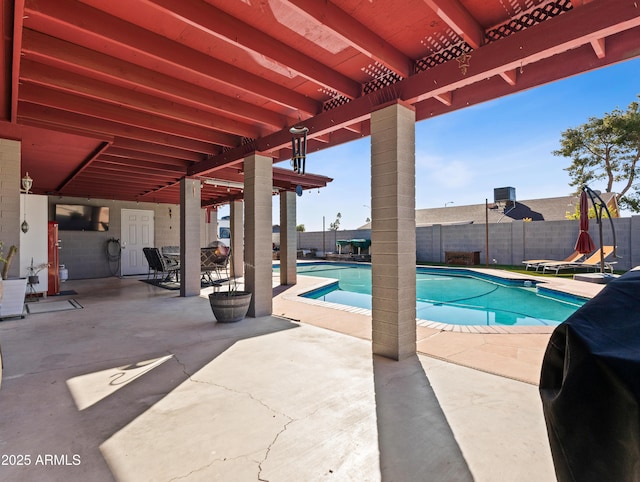 view of swimming pool with a pergola, grilling area, and a patio area