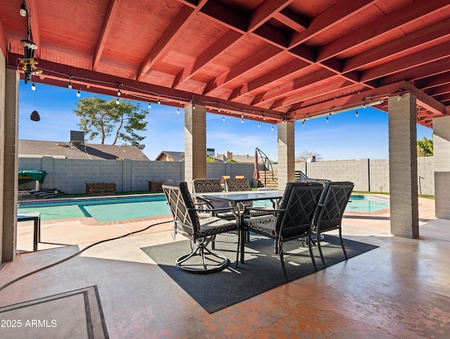 view of patio featuring a fenced in pool