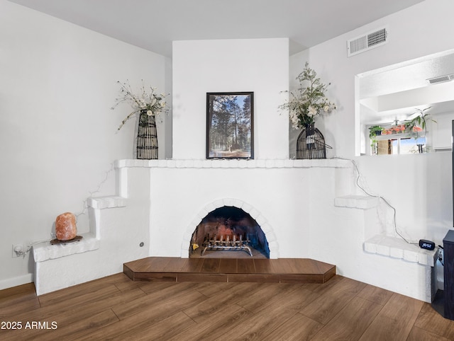 unfurnished living room with hardwood / wood-style flooring