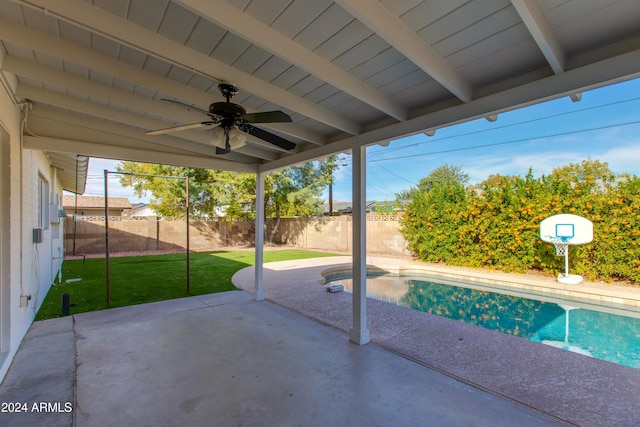 view of pool featuring a patio, a yard, and ceiling fan