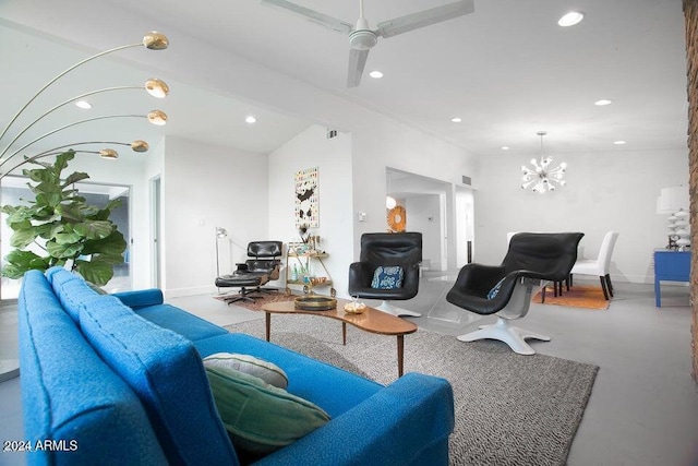 living room featuring lofted ceiling and ceiling fan with notable chandelier