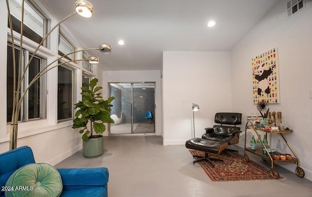 living area with concrete floors