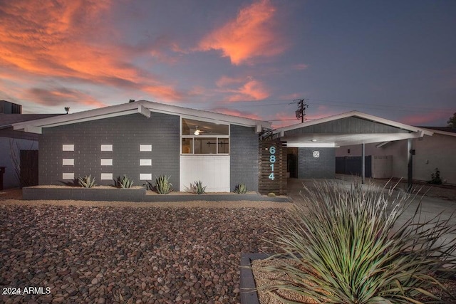 view of front of property featuring a carport