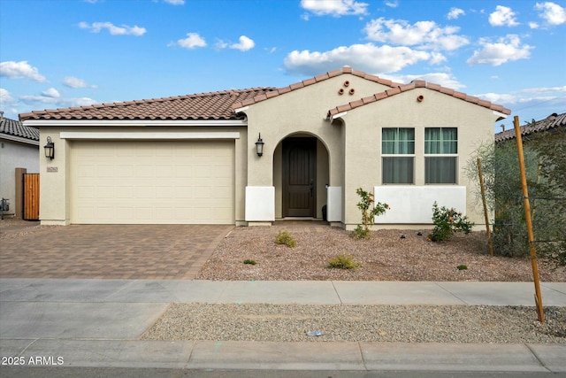 mediterranean / spanish-style home featuring a garage