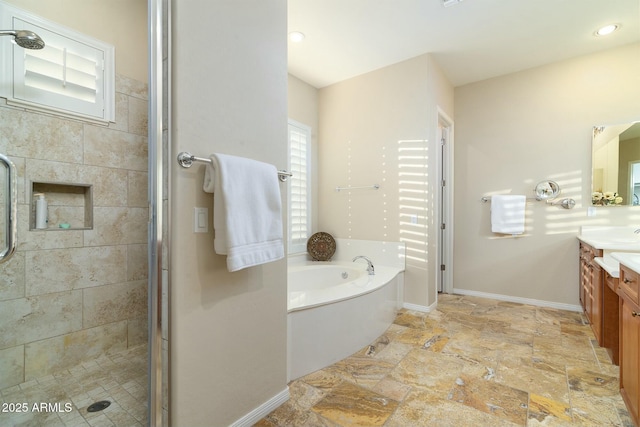 bathroom featuring independent shower and bath and vanity