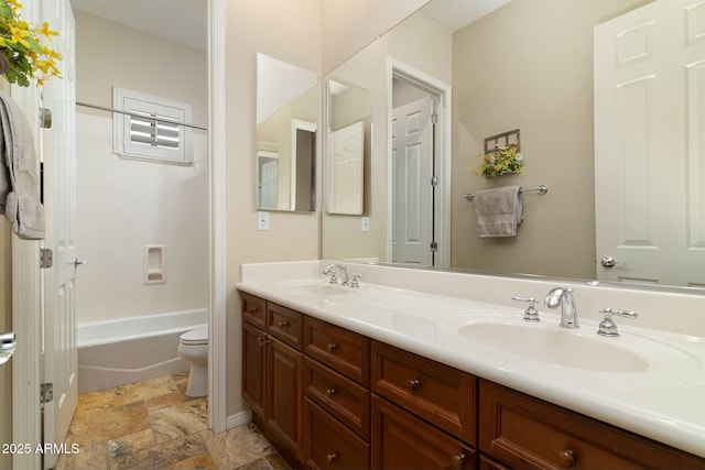 full bathroom featuring shower / tub combination, vanity, and toilet