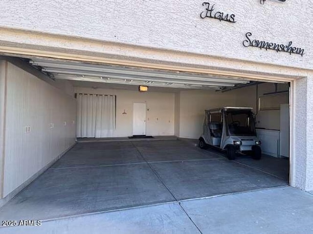 garage featuring a garage door opener