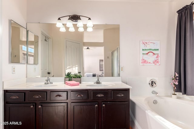 ensuite bathroom featuring a garden tub and double vanity