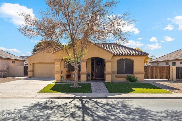 mediterranean / spanish home with a garage