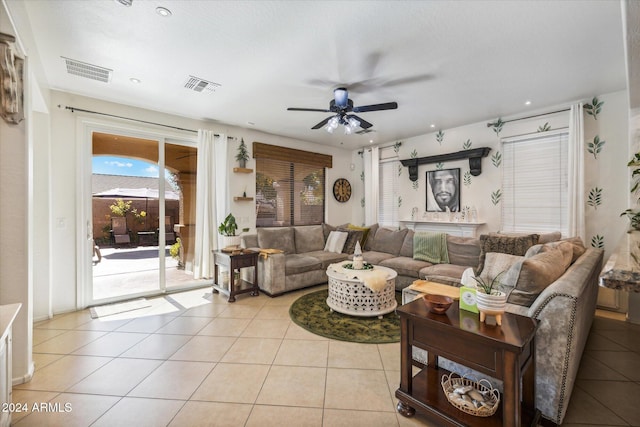 tiled living room with ceiling fan