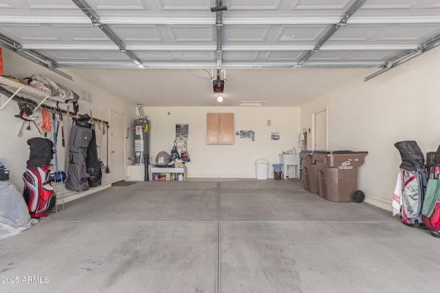 garage with secured water heater, visible vents, and a garage door opener