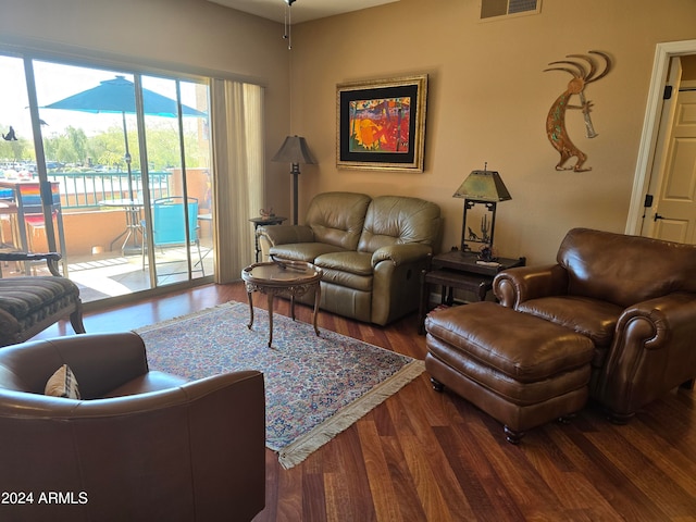 living room with dark hardwood / wood-style floors