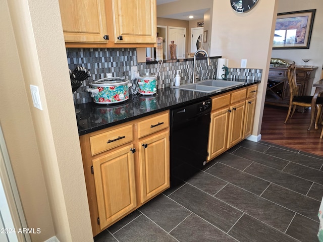 kitchen with sink, dark stone counters, dishwasher, tasteful backsplash, and dark hardwood / wood-style flooring