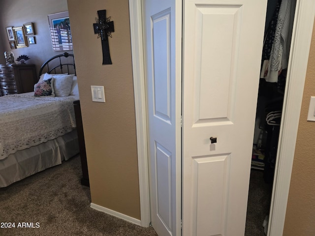 carpeted bedroom with a closet