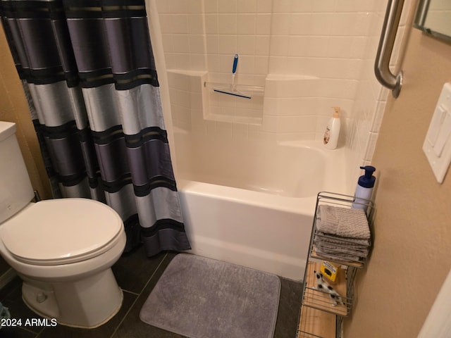 bathroom featuring shower / bath combo with shower curtain, toilet, and tile flooring