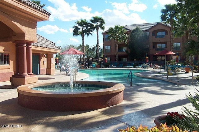 exterior space with pool water feature