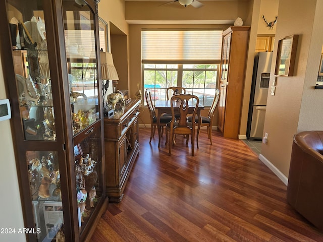 dining space with dark hardwood / wood-style flooring and ceiling fan