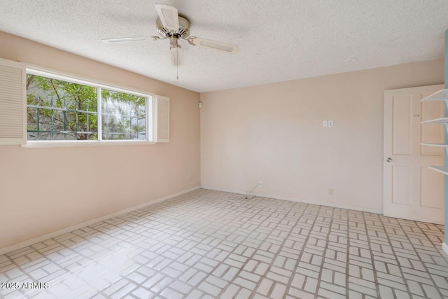 unfurnished room featuring baseboards, a textured ceiling, and ceiling fan