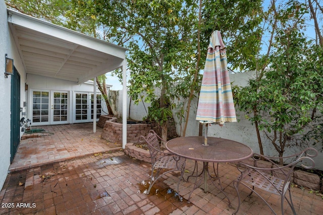 view of patio / terrace featuring french doors and outdoor dining area