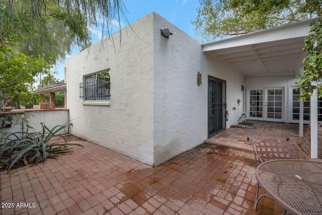 view of patio with area for grilling and french doors