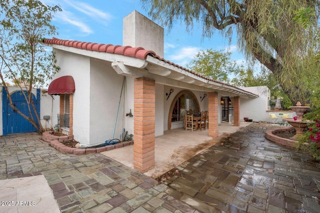 view of patio / terrace featuring a gate