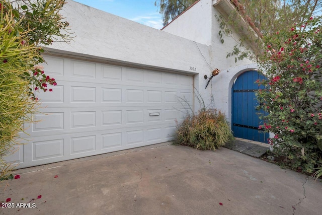 garage with driveway