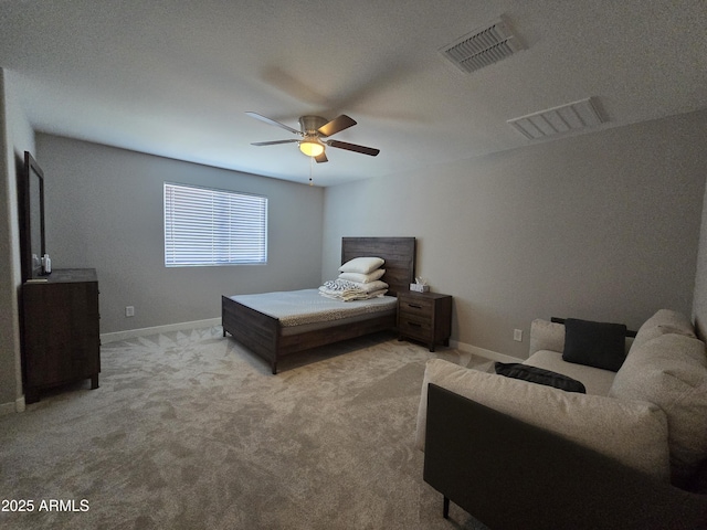 carpeted bedroom featuring baseboards, visible vents, and ceiling fan