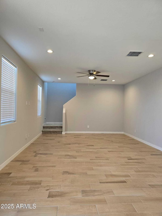 spare room featuring recessed lighting, baseboards, visible vents, and light wood finished floors