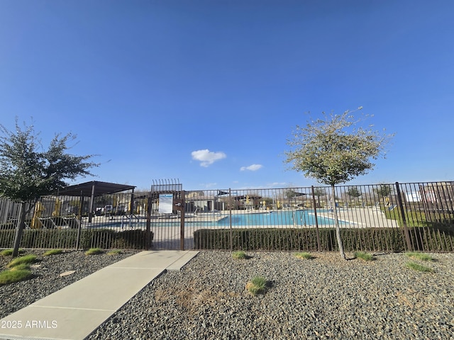 pool featuring a patio area and fence