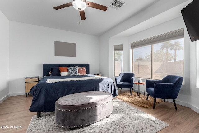 bedroom featuring ceiling fan and light hardwood / wood-style flooring