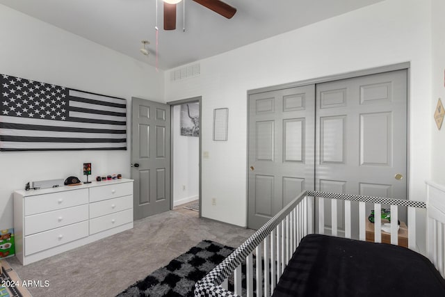 bedroom with light carpet, a closet, and ceiling fan