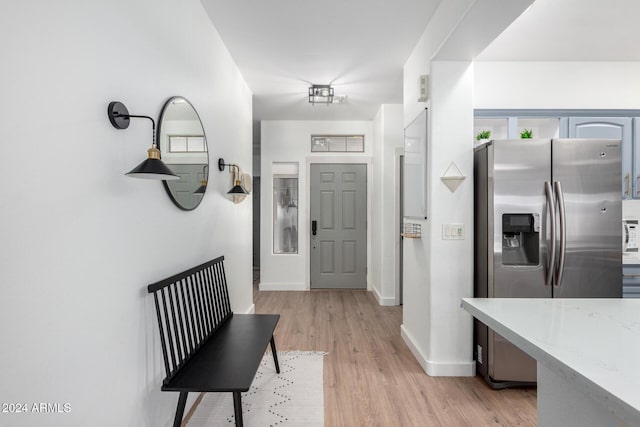 foyer entrance with light wood-type flooring