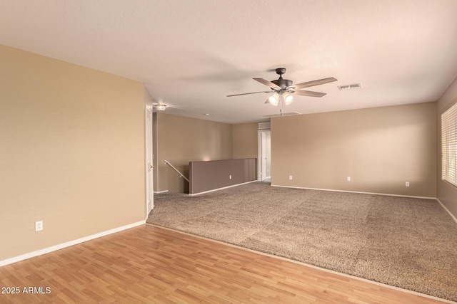 unfurnished room featuring ceiling fan and hardwood / wood-style floors