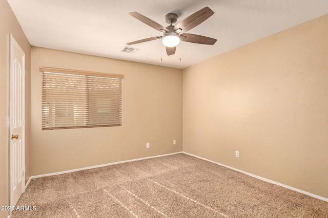 carpeted empty room featuring ceiling fan