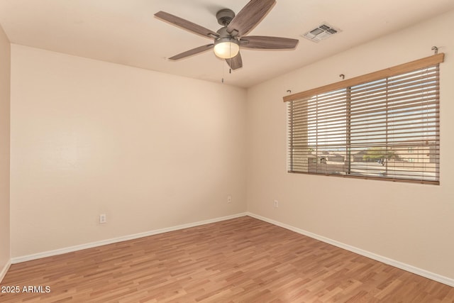 empty room with light wood-type flooring and ceiling fan