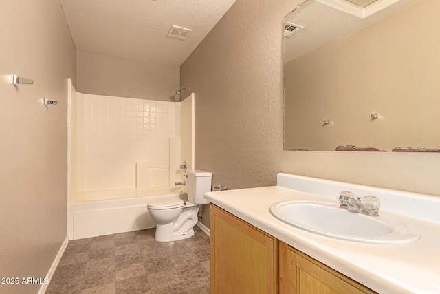 full bathroom with a textured ceiling, toilet, vanity, and  shower combination