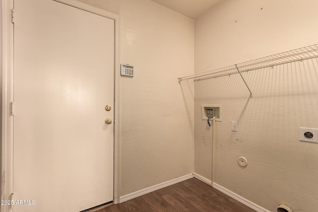 washroom featuring dark wood-type flooring, electric dryer hookup, gas dryer hookup, and hookup for a washing machine