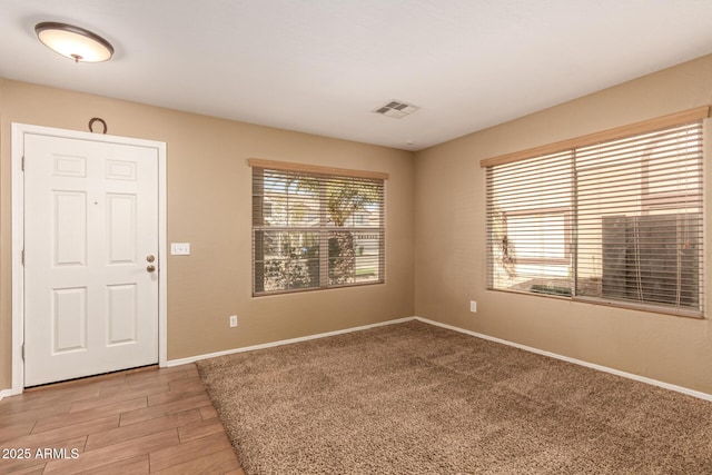 spare room with wood-type flooring