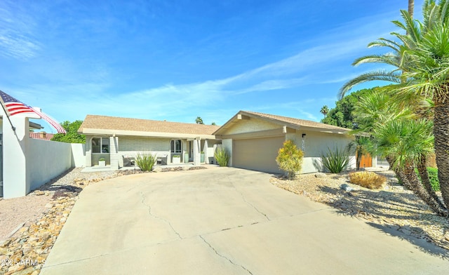 7524 N Via Del Elemental, Scottsdale, AZ 85258 - single story home featuring an attached garage, driveway, and stucco siding